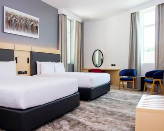 هوليداي إن إكسبرس مطار دبي، آن آي آيتش جي هوتل - دبي - غرفة نوم