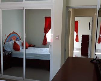 Building of 5 apartments of 1 and 2 bedrooms in a very good and quiet area - Bayahíbe - Habitación