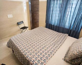 OYO Flagship Raj Hotel Near Juhu Beach - Mumbai - Habitació