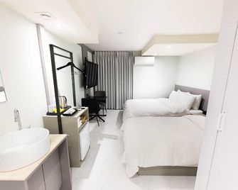 Hotel Lenith Seomyeon - פוסן - חדר שינה