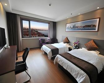 Qingdao Huaneng Hotel - تشينغداو - غرفة نوم
