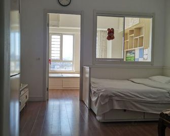 Dongyang Apartment Hotel (Dalian Digital Plaza) - Dalian - Bedroom