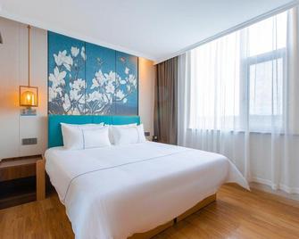 Magnotel Hotel (Qufu Sankong Jingxuan East Road) - Jining - Bedroom