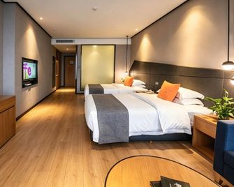 Yunhe Hotel (University Town 772 Rainbow Street Branch) - Liuzhou - Schlafzimmer