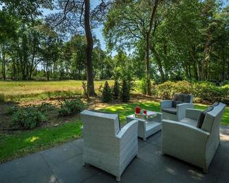 Sprielderbosch 25 Luxury holiday home on a holiday park in the Veluwe - Garderen - Binnenhof
