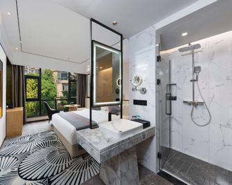 Jijia Impression Hotel (Huangshi Wanda Plaza) - Huangshi - Bedroom