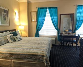 Athens Hotel Suites - Houston - Schlafzimmer