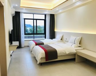 Thank Inn Hotel Hainan Dongfang Sanjiao Park - Dongfang - Bedroom