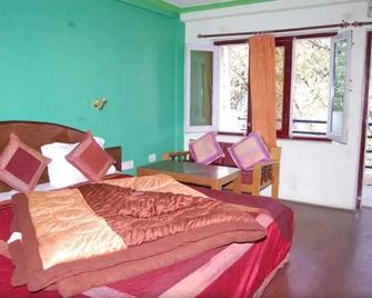 Goroomgo Hotel Shivay Kausani - Kausani - Bedroom