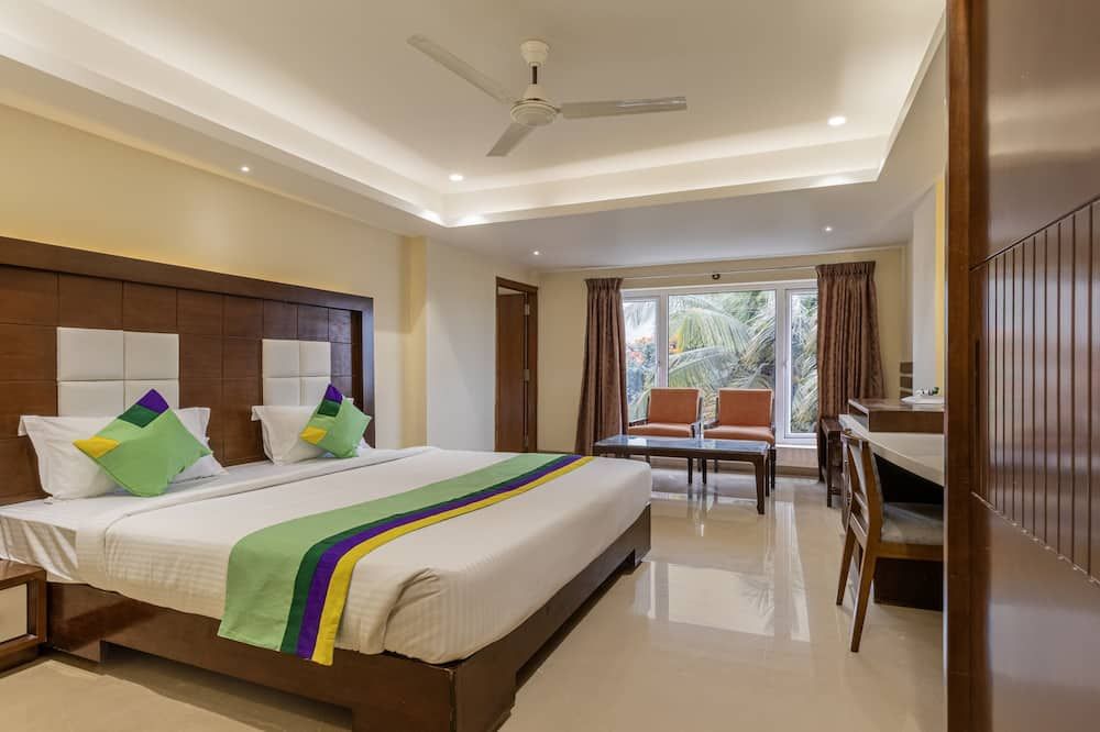Treebo Suvarna Comforts - Hassan - Bedroom