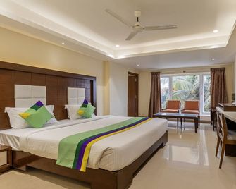 Treebo Suvarna Comforts - Hassan - Bedroom