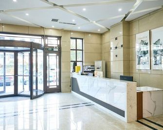 Jilin Junhe Holiday Hotel - Jilin - Front desk