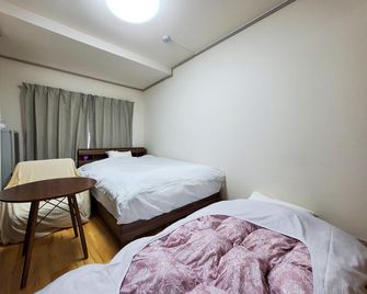 Samurai City Inn Shinobuya - Aizuwakamatsu - Schlafzimmer