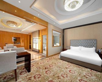 Wanda Spring Business Hotel (Daqing Sa'ertu Wanda Plaza) - Дакінг - Спальня