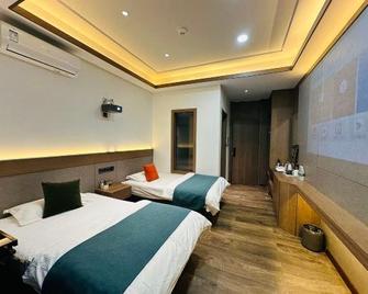 Greater Khingan Tahe Chengxin Business Hotel - Da Hinggan Ling - Bedroom