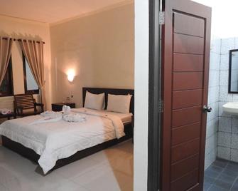 D'Batur Hotel - Mangsit - Habitación