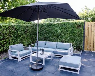 Familie bungalow op vakantiepark bij zee - Baarland - Patio