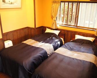 Fumoto Ryokan - Minamioguni - Schlafzimmer