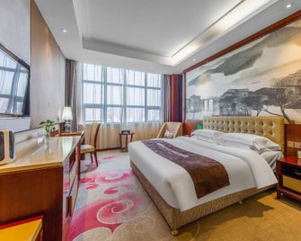 Guan Jiang Nan Hotel - Xiangyang - Bedroom