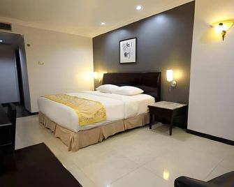 Hotel Banjarmasin International - Banjarmasin - Bedroom