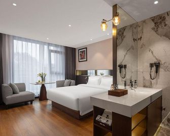 Qili Hotel (Luoyang Wangcheng Park Qilihe Subway Station) - Luoyang - Soveværelse