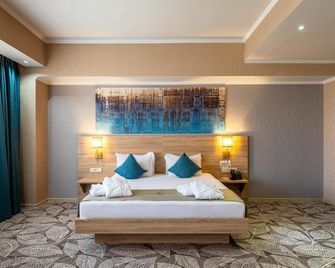 فندق رينيون بارك - ألماتي - غرفة نوم