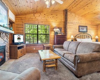 Fireplace, Whirlpool Tub and Private Balcony Retreat - Inviting Cozy Cabin - Branson - Living room