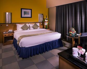 Baisan International Hotel - מאנאמה - חדר שינה