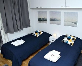 Kotimaailma Apartments Joensuu - Koulukatu 21 - Joensuu - Schlafzimmer