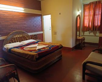 White Orchid Resort - Mysuru - Schlafzimmer