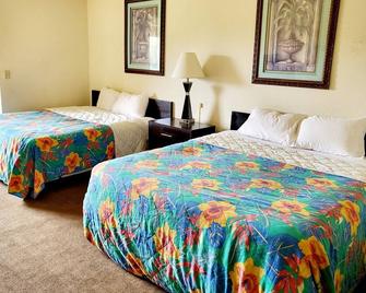 Metro Inn & Suites - Jacksonville - Bedroom