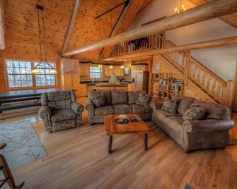 Exceptional log home on 9+ acres with frontage on Big St. Germain Lake - Saint Germain - Living room