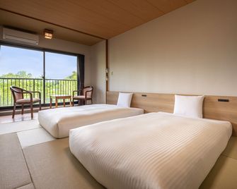 كامينوي هوتل أوكونيكو - نيكو - غرفة نوم