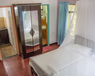 إيدن جاردن أيورفيديك هيلث ريتريت - فاركالا - غرفة نوم