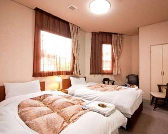 Utsunomiya Riverside Hotel - Utsunomiya - Schlafzimmer