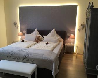 Hotel Garni Zum Grünen Baum - Hovelhof - Спальня