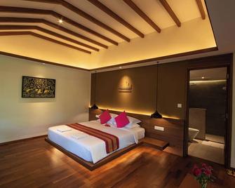 باجان ثيريبيتسايا ساكتشواري ريزورت - باغان - غرفة نوم