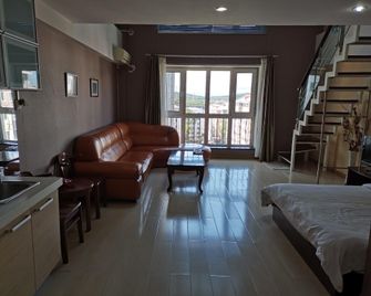 Fubon Hotel Apartments - Mudanjiang - Wohnzimmer