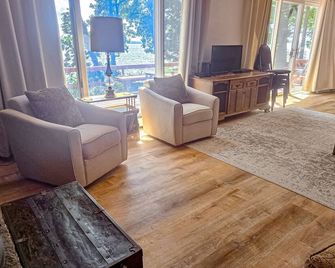 Incredible lakefront house with cottages, dock, fire pit, decks, & amazing views - Topinabee - Living room