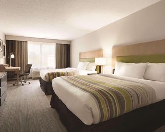 Country Inn & Suites by Radisson, Washington DC E - Capitol Heights - Спальня