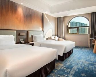 Wanjia Oriental Hotel - קואנג'ואו - חדר שינה
