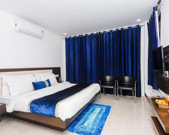 إيليوت إكزوتيكا - دهارامشالا - غرفة نوم