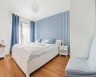 Apartamenty Sun & Snow Bursztynowa - גדנסק - חדר שינה