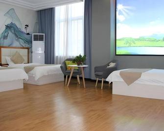 Shell Kaifeng City Lancao County Women and Children Hospital Hotel - Kaifeng - Bedroom