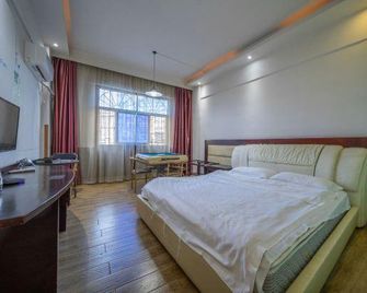 Weikang Hotel Jishoudaxuedian - Zhangjiajie - Habitación