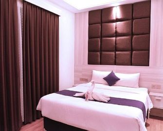 Grand Sahman Hotel - Surakarta - Slaapkamer