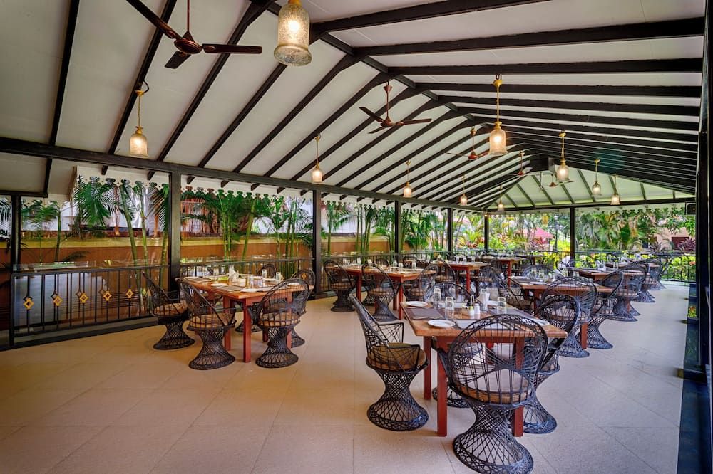 De Mandarin Beach Resort Suites & Villas - קנדולים - מסעדה