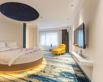Zhongzhou Exquisite Hotel (Jiaozuo High-speed Railway Station Store) - Jiaozuo - Slaapkamer