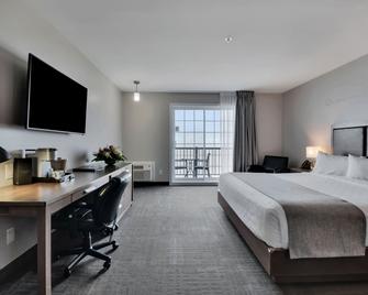 Hôtel et Pavillons Le Petit Manoir du Casino - לה מאלבאי - חדר שינה