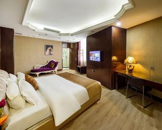 Jianke Holiday Hotel - Shiyan - Camera da letto